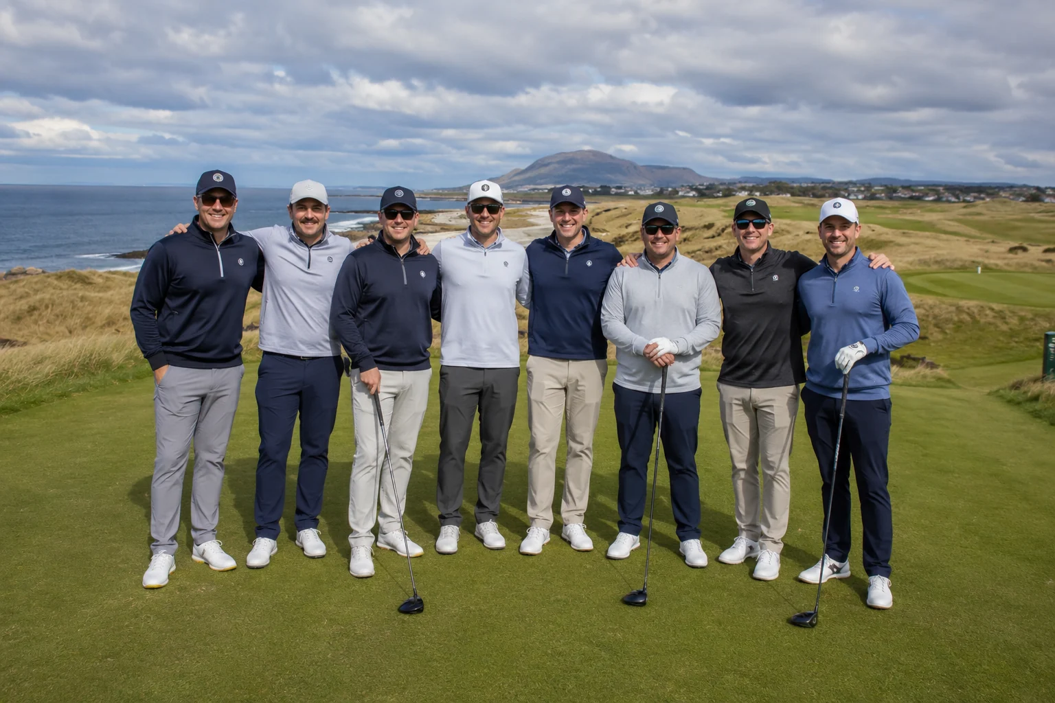 Group of golfers lined up on a coastal links tee box on a golf trip